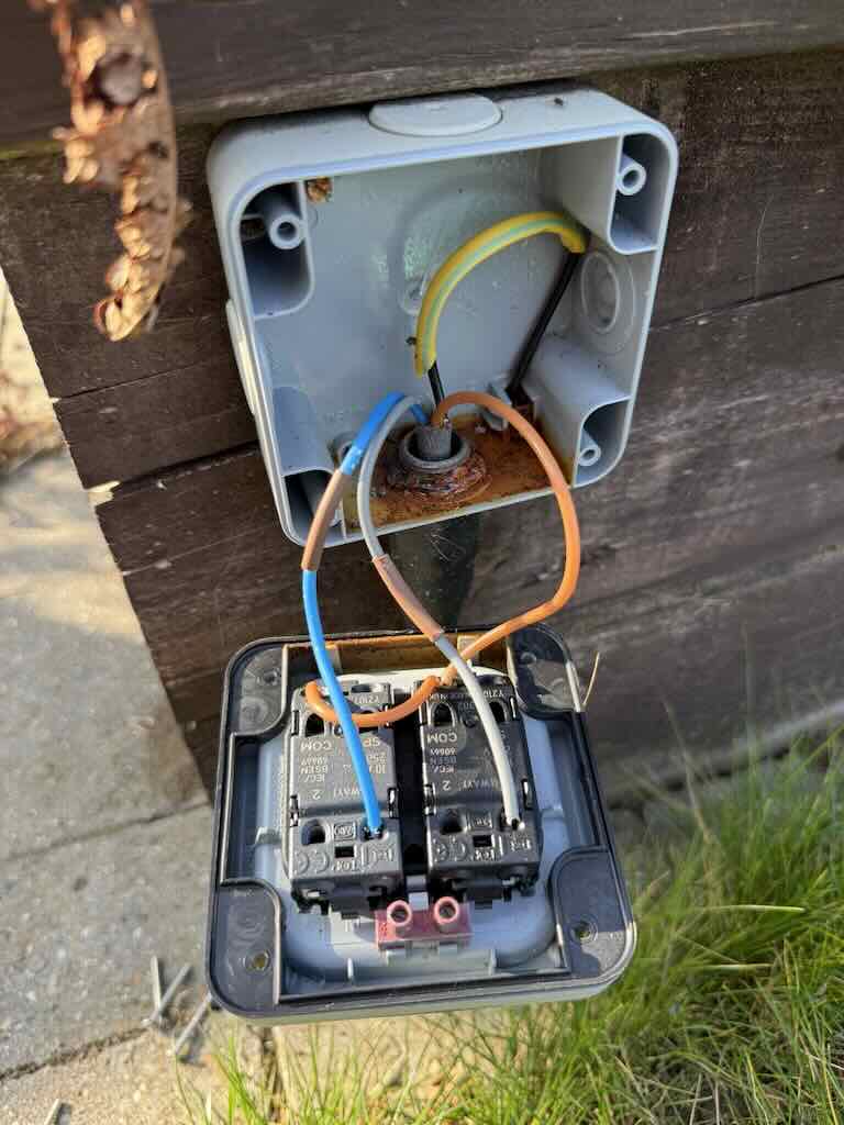 EICR in Chedburgh - JDH Electrics - Damp & corroded outside socket