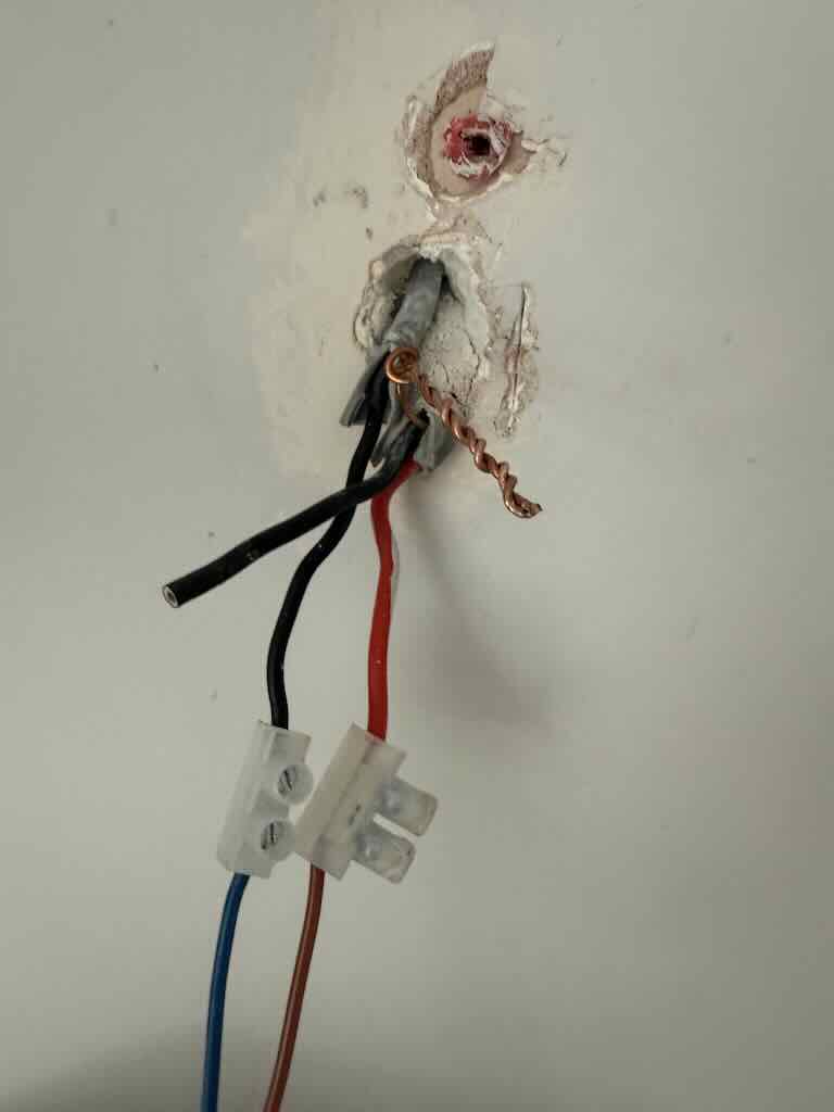 EICR in Chedburgh - JDH Electrics - Screw in lighting cable from light fixing, causing a short circuit fault on neutral to earth